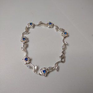 Very Nice Little Silver Tone Flower Bracelet With Blue And Clear Rhinestones